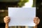 Senior woman`s Hands women holding paper blank a4 size in bokeh background, Selective focus, Communication, business concept