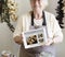 Senior woman selling organic gourmet produce at a deli