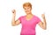 Senior woman shows thermometer and gesturing OK