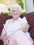 Senior woman sitting on garden chair