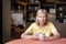 Senior woman sitting at table