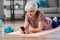 senior woman with smartphone exercising at home