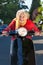 Senior woman speeding on a scooter
