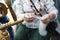 Senior woman spins thread of wool