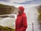 Senior woman is standing at a Gullfoss waterfall - Iceland