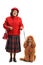 Senior woman standing with a red poodle dog