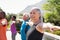 Senior woman stretching arms in yoga class