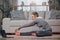 Senior woman, stretching and laptop on yoga mat for exercise, spiritual wellness or workout in online class. Elderly