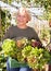 Senior woman taking greens in her hands