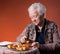 Senior woman tasting apple pie