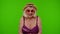 Senior woman tourist in swimsuit bra looking at camera, smiling, starting laughing on chroma key