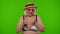 Senior woman tourist in swimsuit wearing hat, waving hands hi hello welcome greetings on chroma key