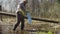 Senior woman volunteer collecting garbage in the pond