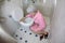 Senior woman vomiting in the bathroom