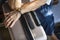 Senior woman waiting with her luggage at a hotel