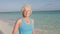 Senior Woman Walking On Beautiful Beach