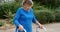 Senior woman walking with walker 4k