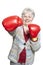 Senior woman wearing boxing gloves smiling