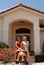 Senior women in front of home