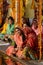 Senior women perform puja - ritual ceremony at holy Pushkar Sarovar lake,India