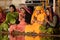 Senior women perform puja - ritual ceremony at holy Pushkar Sarovar lake,India