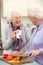 Senior women preparing meal together