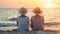 Senior women in straw hats sitting on beach at sunset, summer travel outdoor concept