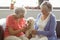 Senior women stroking a dog