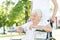 Senior Women in Wheelchair with Caretaker