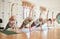 Senior yoga, workout class in a gym studio with pilates, exercise and fitness women friends. Retirement home health