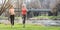 Senior and young woman running as sport on a meadow in spring