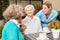 Seniors and caregivers make small talk