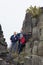 Seniors and child hiking on the rock