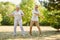 Seniors exercise with tires in summer