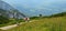 seniors hiking in mountain on summer day