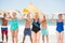 Seniors holding surfboards at the beach