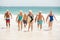 Seniors holding surfboards at the beach