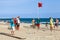 Seniors men play Bocce on sandy beach in Spain