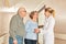 Seniors shake hands with geriatric nurse