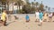 Seniors Spaniards play Bocce on sandy beach