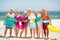 Seniors standing in a row at the beach