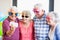 Seniors taking a selfie with funny glasses