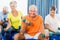 Seniors using exercise ball and weights