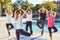 Seniors in the yoga class do an exercise