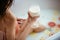 Sensual attractive woman relaxing in bath with glass of milk.