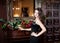 Sensual attrctive woman in luxury interior in black dress