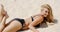 Sensual Blond Woman Lying on the Beach