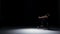 Sensual contemporary dance performance of one dancers on black, shadow