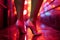 Sensual female legs in sexy high heels in a provocative red light district nightclub - generative AI