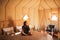 Sensual glamour portrait woman in interior of modern luxury glamping tent camp